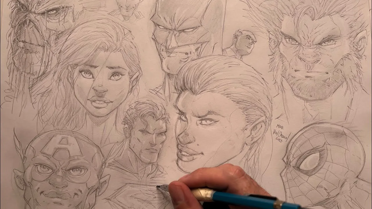 Mike's hand inking a sheet of comic heads, signed 2023